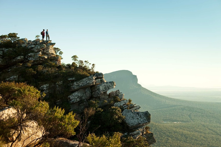 Hikers look out across the Grampians National Park in Victoria's west.