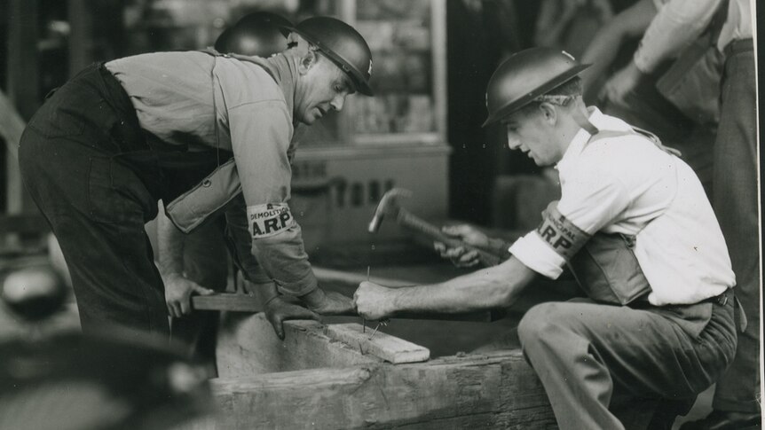 Bunker: Men learning how to prop up verandah during World War II