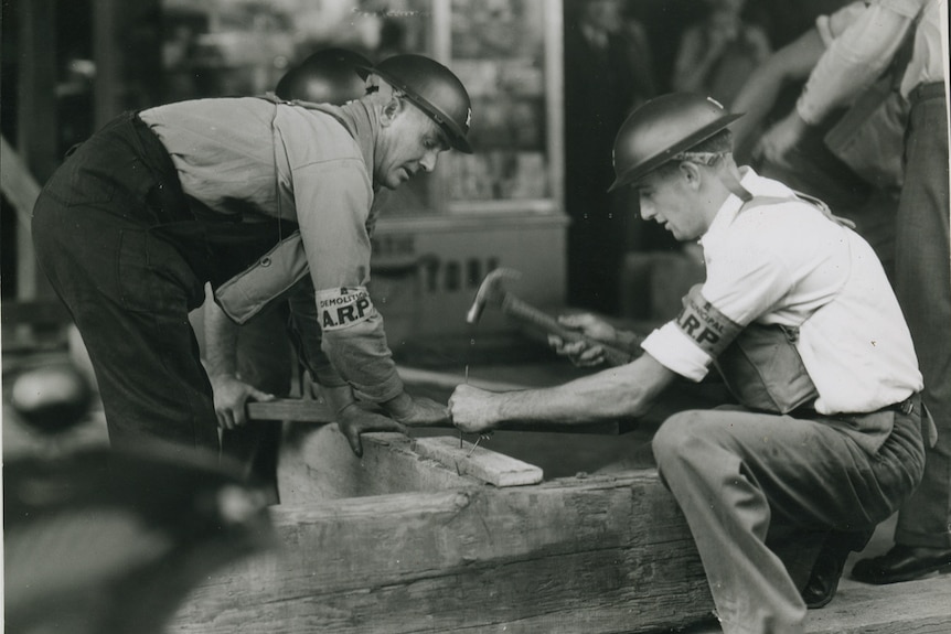 Bunker: Men learning how to prop up verandah during World War II