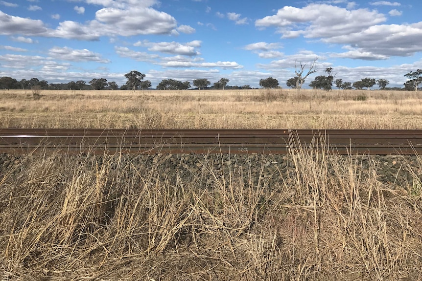 Picture of wide sky with railtracks in the foreground