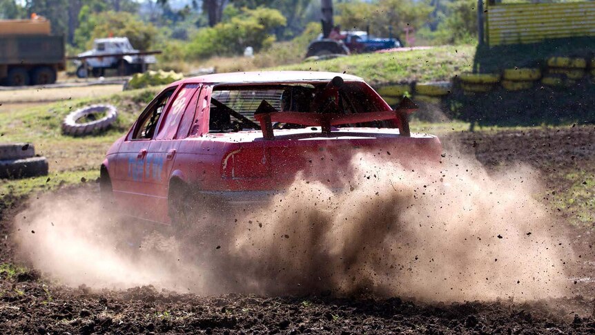 Dust and mud flies during a race at mud races in Kabra