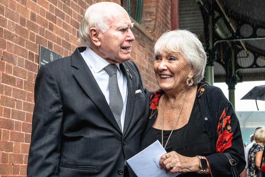 John Howard pictured with Caryl Raper at Johnny Raper's state funeral