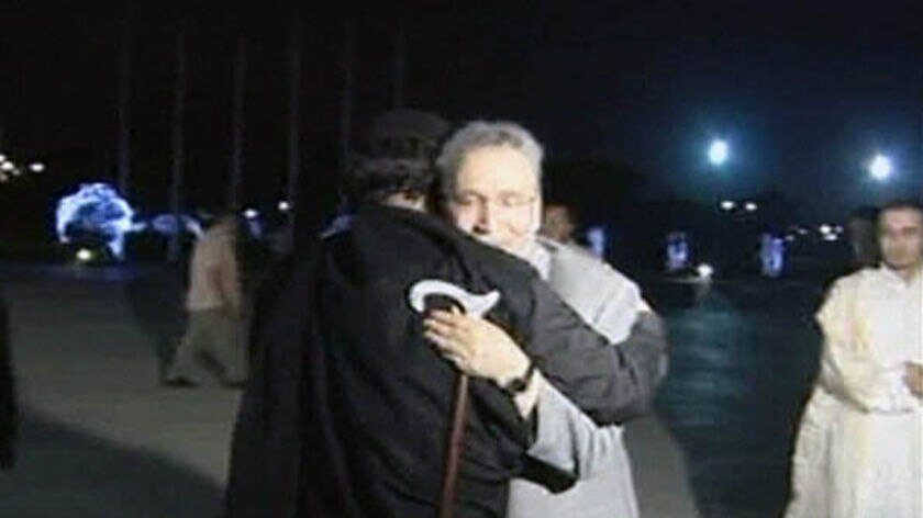 Gaddafi hugs Lockerbie bomber al-Megrahi.