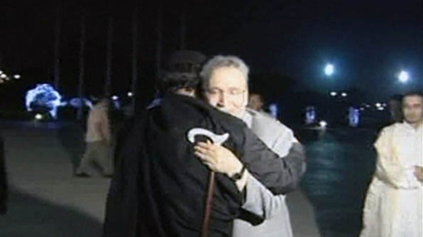 Moamar Gaddafi (left) hugs Lockerbie bomber Abdel Baset al Megrahi on his return to Libya in 2009.