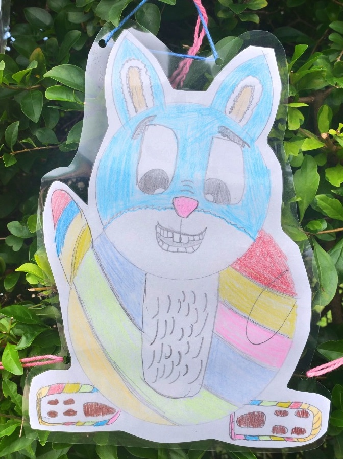 A hand drawn bunny picture with Easter eggs