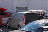 A body being identified in a NSW shopping centre carpark.