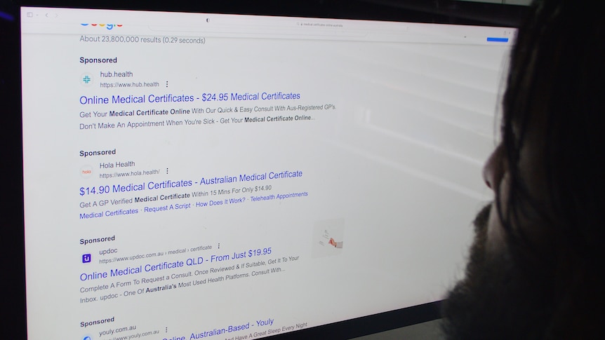 Man looks at screen that says online medical certificates Australia