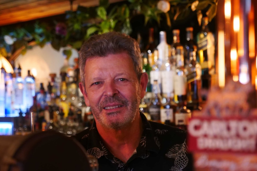 man smiling with grey beard