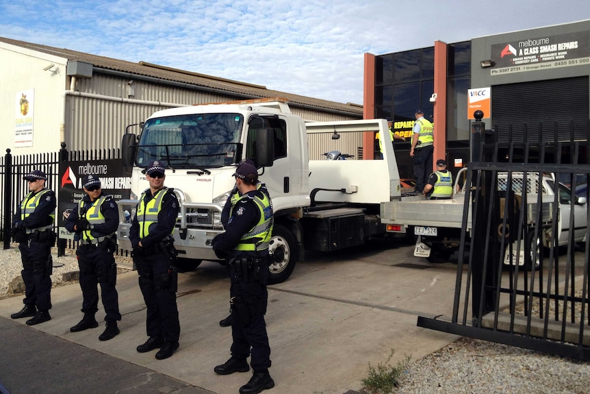 Vic Police stand outside Williamstown property that was raided