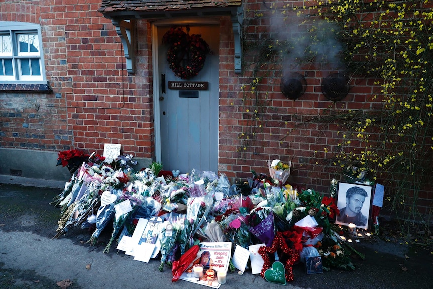 Tributes are seen outside the house of singer George Michael, called Mill Cottage.
