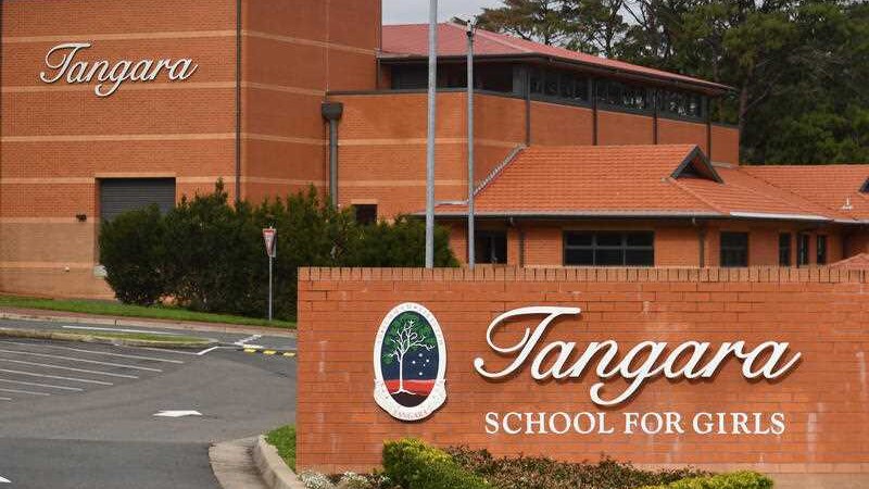 A red brick building with a sign that says Tangara school for girls.