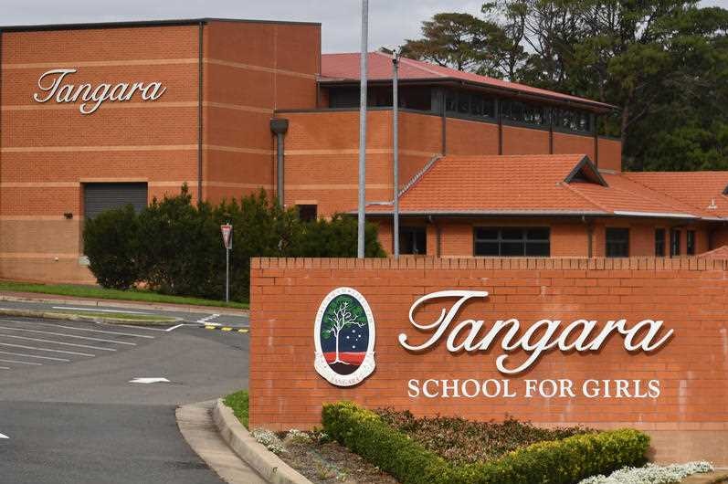 A red brick building with a sign that says Tangara school for girls.