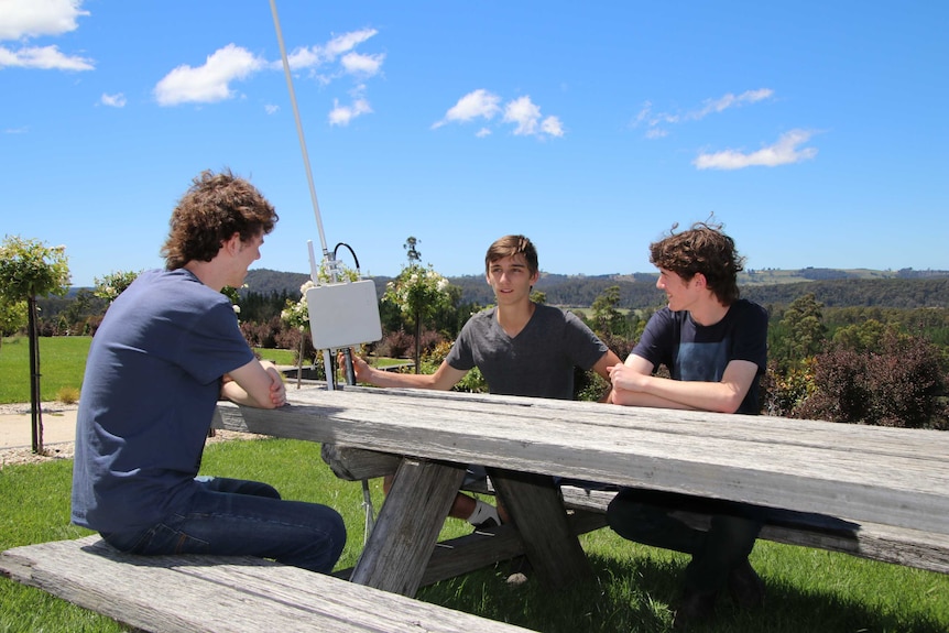 (left to right) Jack Kelly, Caleb Anderson and Rory Kelly have developed software that allows farmers to control farm machinery from their smart phones