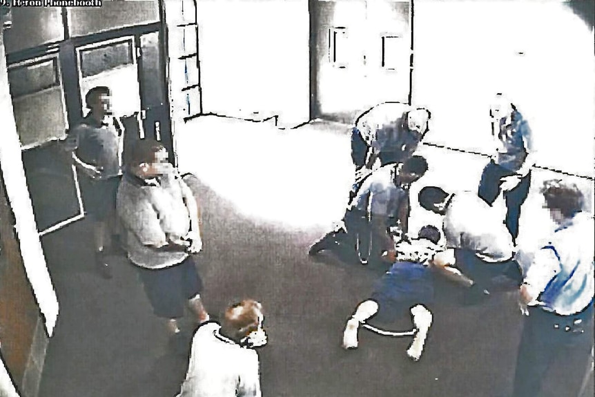 The boy, 17, is placed in handcuffs and ankle cuffs in Cleveland Youth Detention Centre.