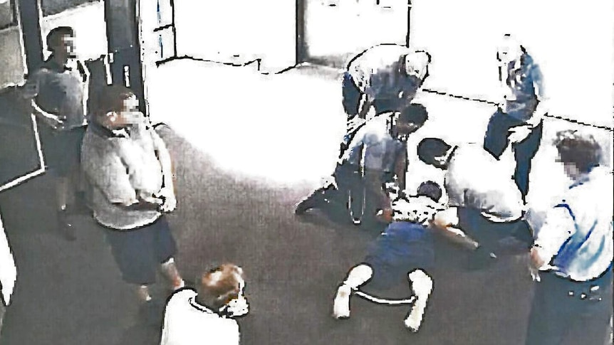 The boy, 17, is placed in handcuffs and ankle cuffs in Cleveland Youth Detention Centre.