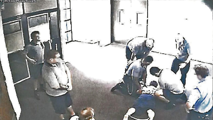 The boy, 17, is placed in handcuffs and ankle cuffs in Cleveland Youth Detention Centre.