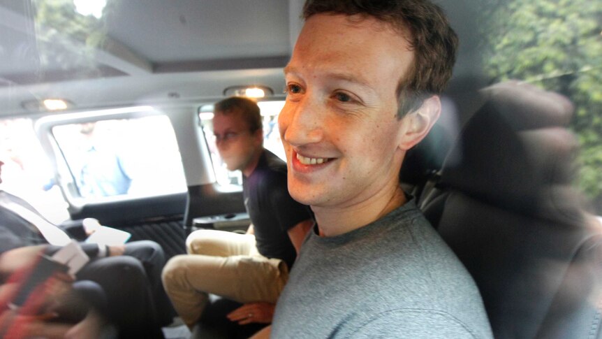 Mark Zuckerberg rides in the back of a car through Delhi in India.