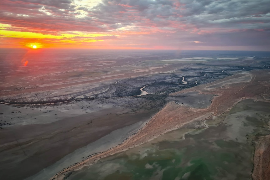 Sunrise over the Diamantina River near Birdsville.