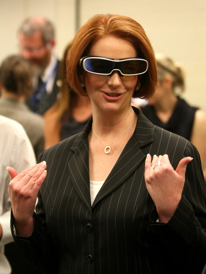 Julia Gillard tries on a pair of 3D glasses (AAP: Stuart McEvoy)