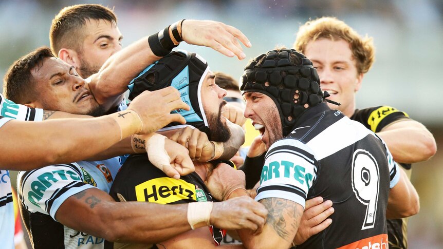 Heated clash ... Michael Ennis (r) and Jamie Soward get involved in a melee