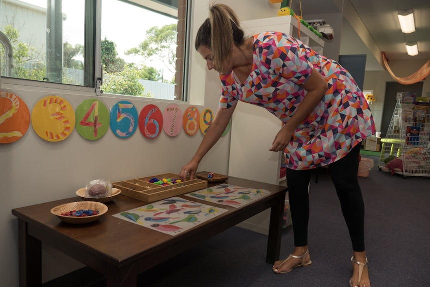 Ms Camporeale sets up the interactive play and learning area.