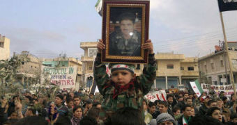 Demonstrators protest against Syrian president Bashar al-Assad in 2011.