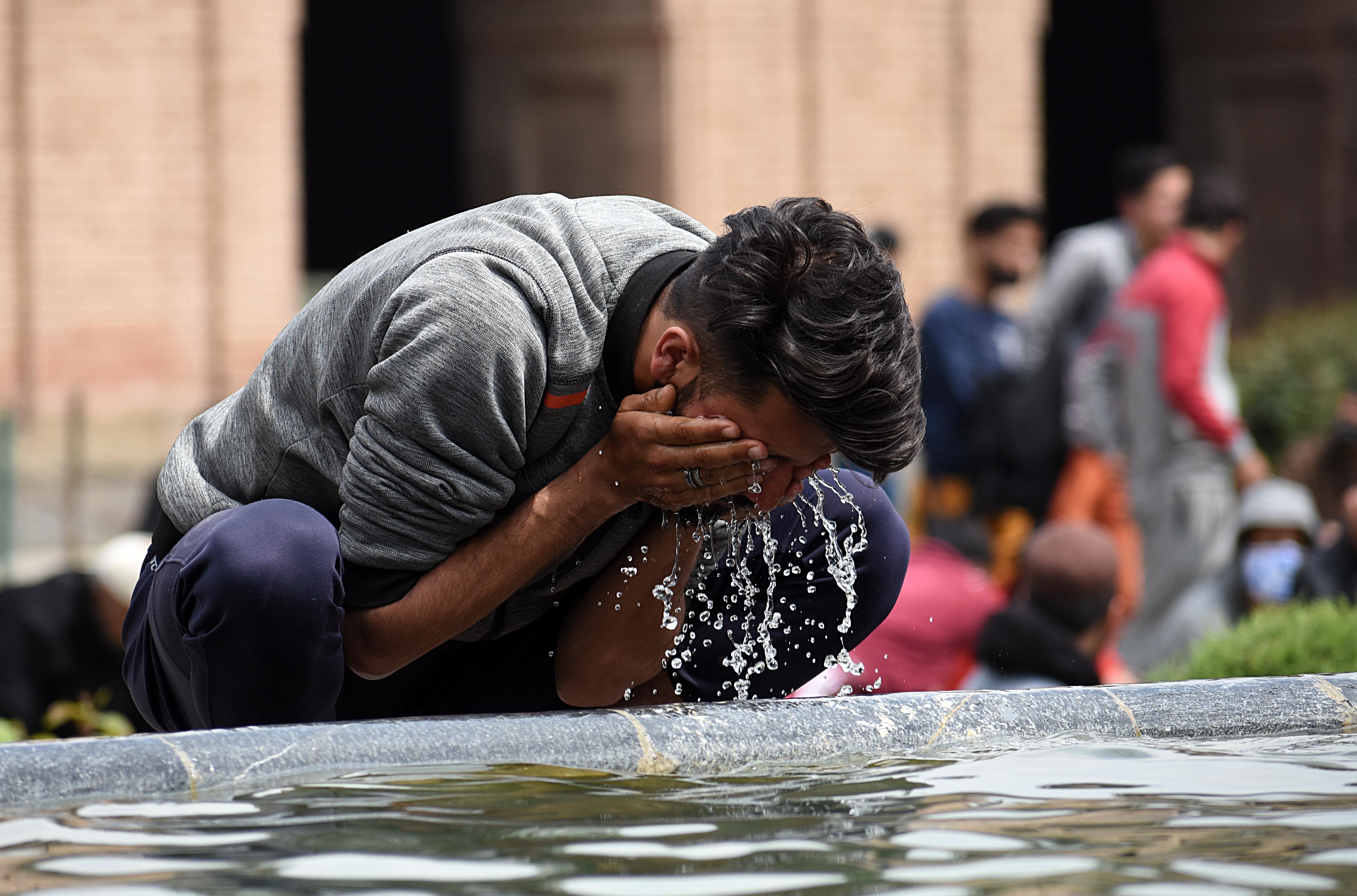 A Muslim man washes his face with water before prayer in a mosque in Kashmir. 