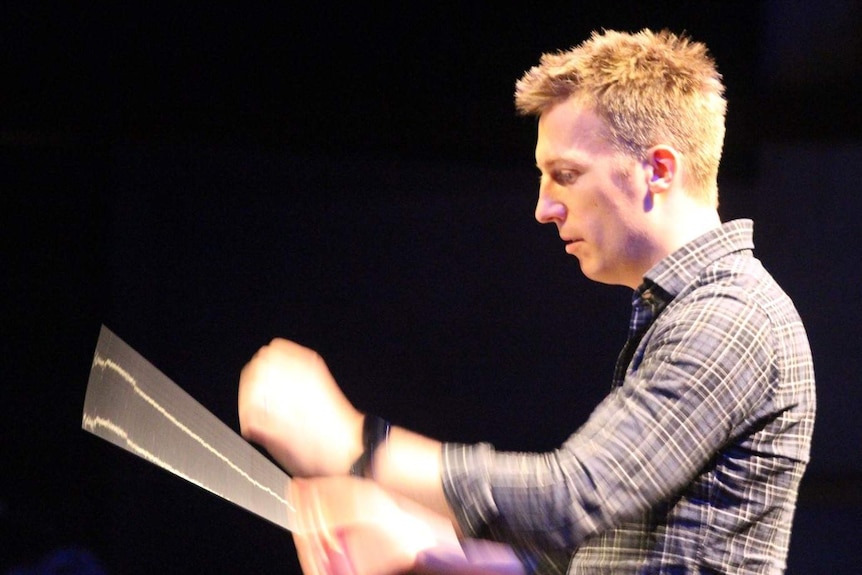 Conductor Nicholas Buc at a rehearsal for Close Encounters of the Third Kind in Concert.