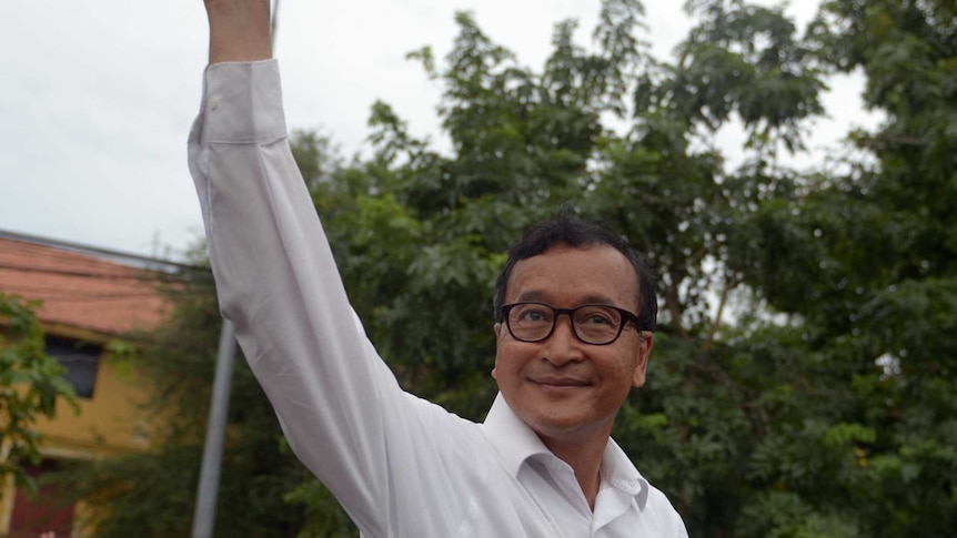 Sam Rainsy waves to supporters