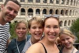 Sam Cardone (second from right) with her family at the Colosseum in Rome.