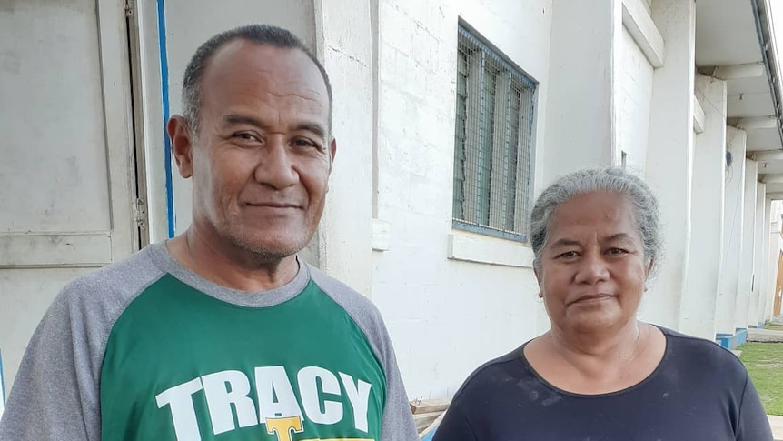 Reverend Kisina Toetu'u and his wife Maa'imoa hold hands looking at the camera.