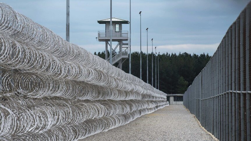 Razor wire protects a perimeter of the Lee Correctional Institution