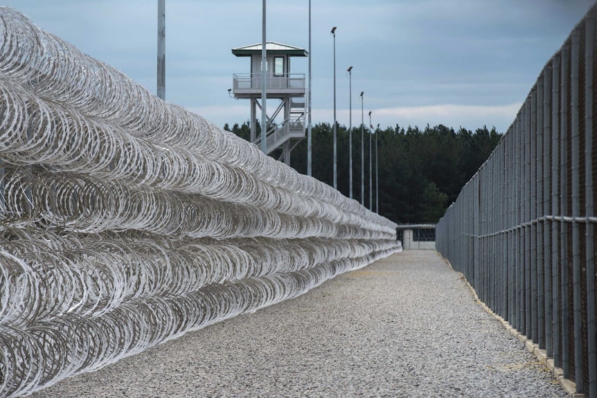 Razor wire protects a perimeter of the Lee Correctional Institution