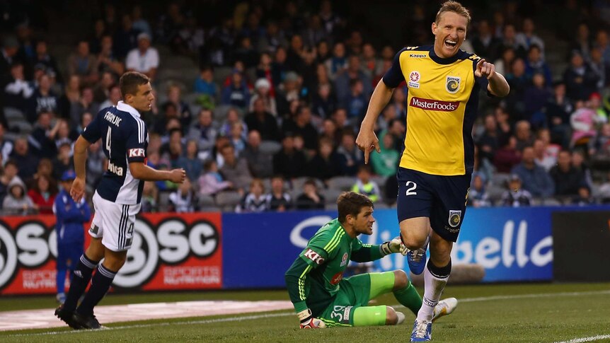 The Mariners' Daniel McBreen scores against the Melbourne Victory at Docklands.