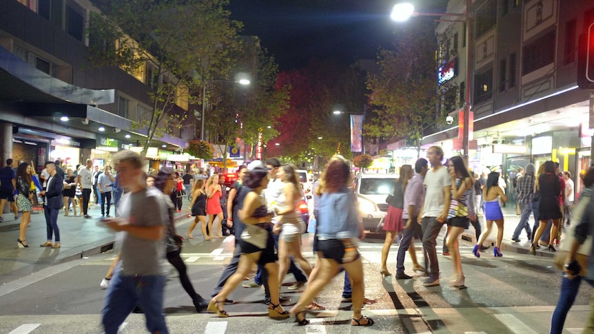 People walk through Kings Cross