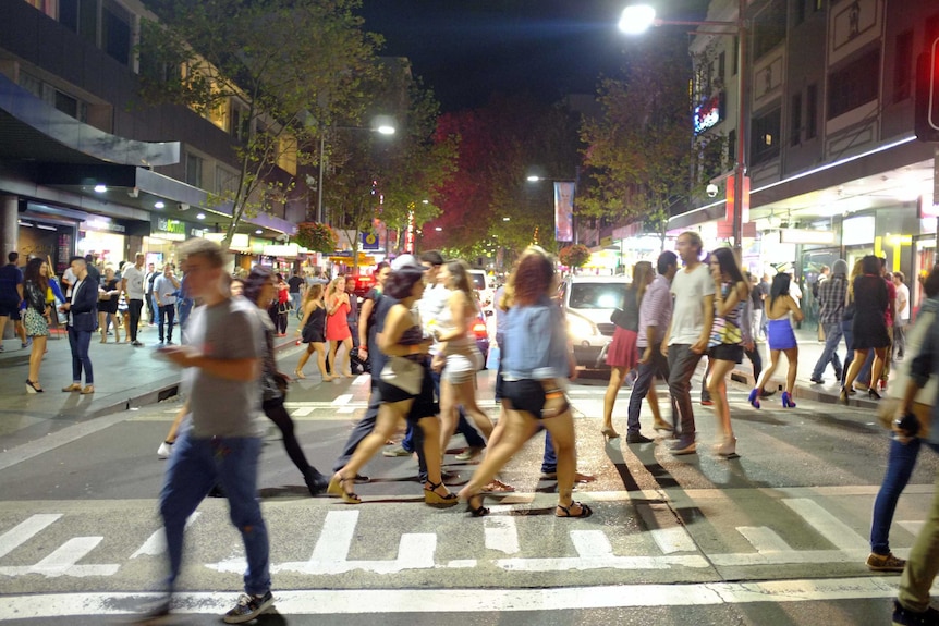 People walk through Kings Cross