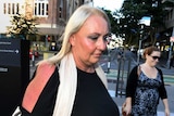 Amy Robinson walks into the District Court in Brisbane