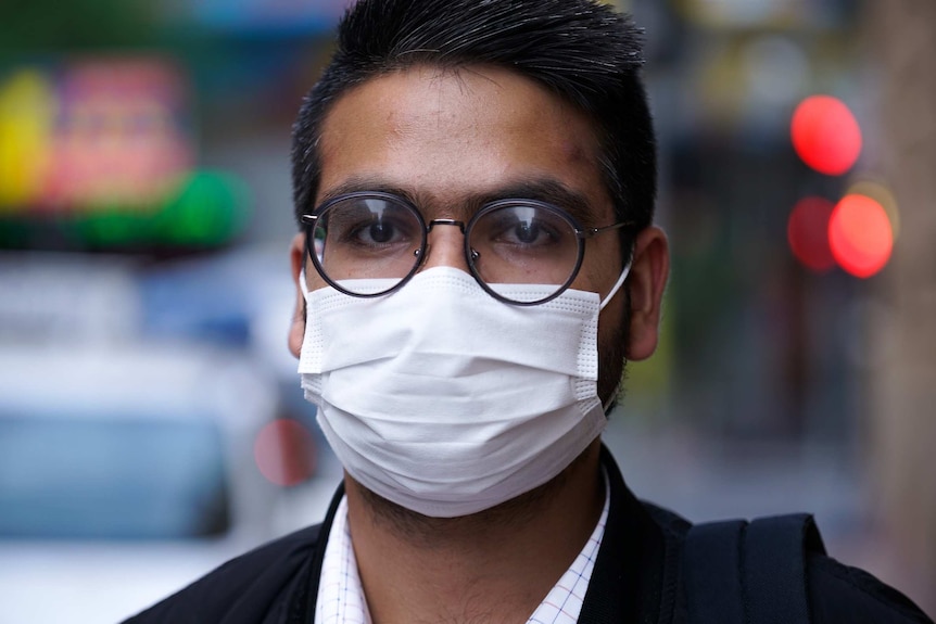 A man wears a face mask.