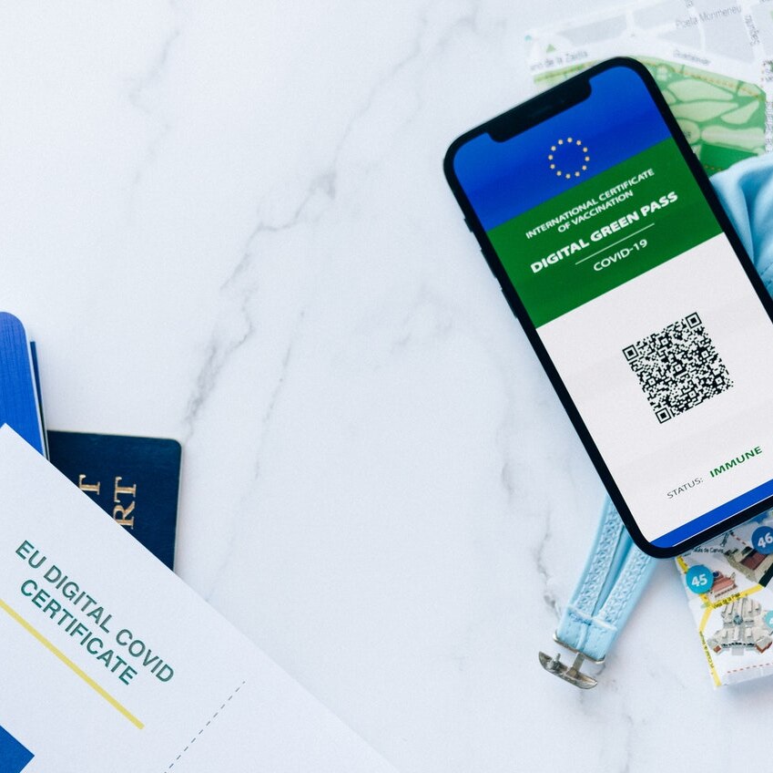 An EU passport and digital green pass for COVID-19 on a smart phone.