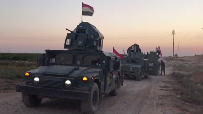 Iraqi soldiers on military vehicles in the Qatash area head towards Kirkuk gas plant.