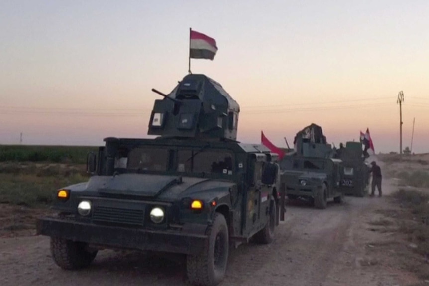 Iraqi soldiers on military vehicles in the Qatash area head towards Kirkuk gas plant.