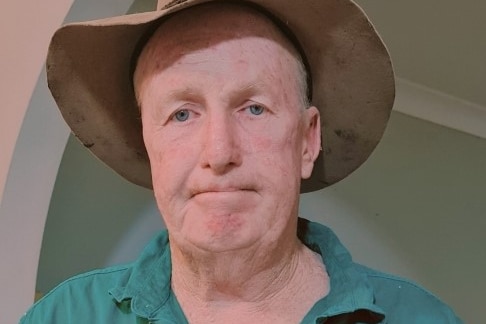 An older man in a wide-brimmed hat 