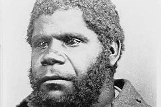 A black and white photo of an Aboriginal man