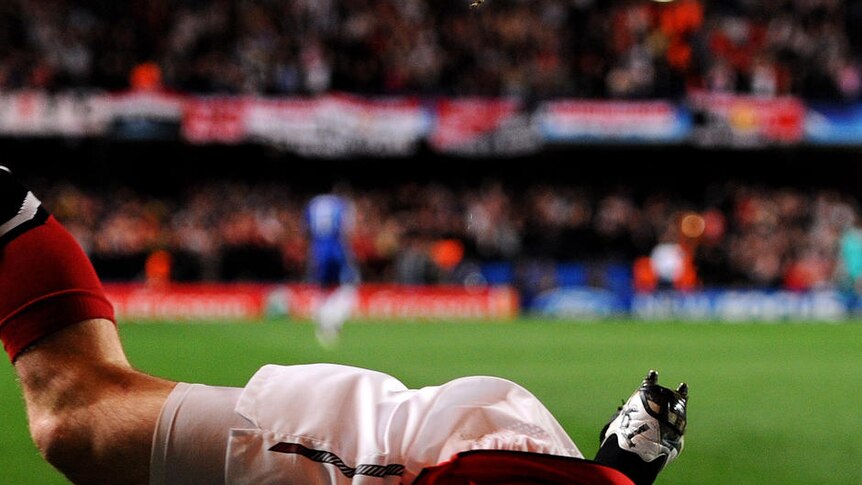 Wayne Rooney celebrates the winner at Stamford Bridge.