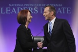 Julia Gillard and Tony Abbott shake hands ahead of the Federal Election leaders' debate.