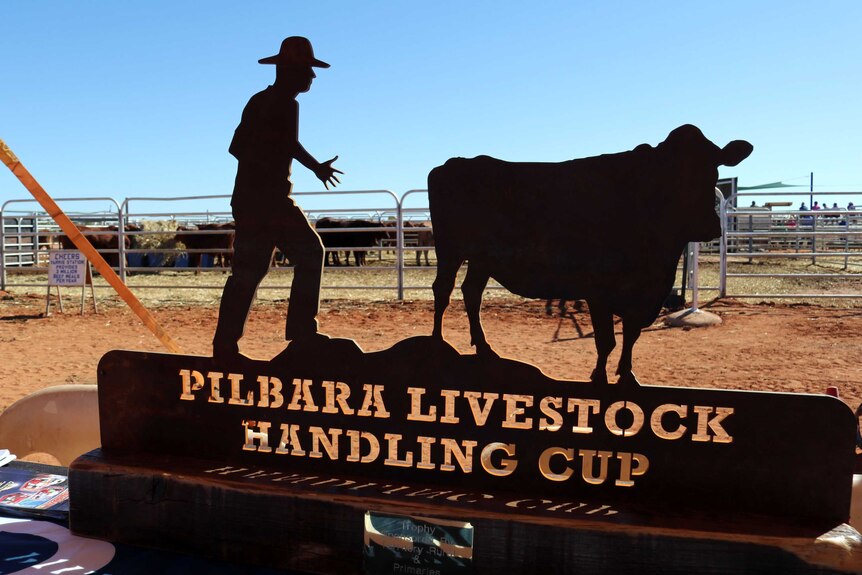 The Pilbara Livestock Handling Cup is large and heavy with a steel cut out of a handler encouraging a beast forward