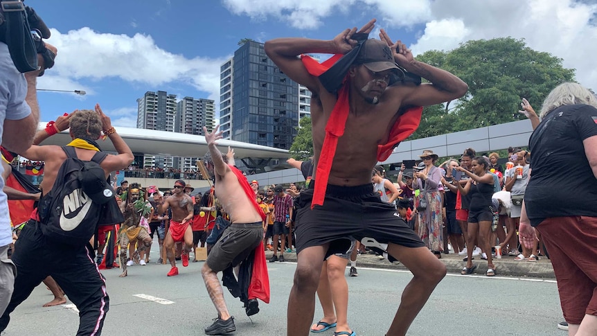 People dance during Invasion Day rally