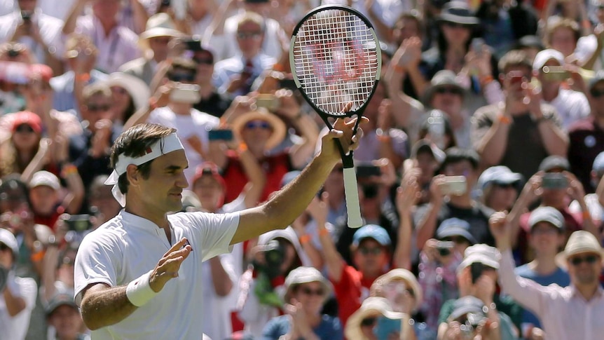 Roger Federer salutes the crowd after beating Dusan Lajovic at Wimbledon on July 2, 2018.