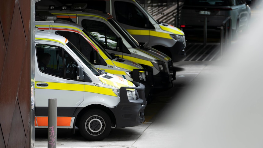 Ambulances in a line in an underground driveway