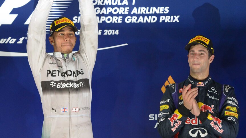 Hamilton celebrates alongside third-placed Ricciardo